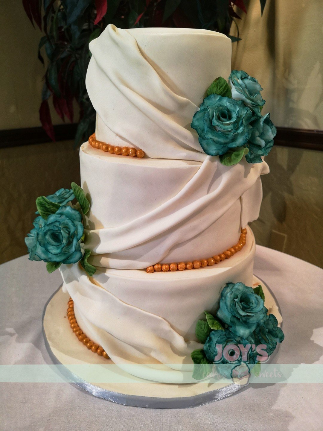 Elegant Cake with Sash and Sugar Flowers